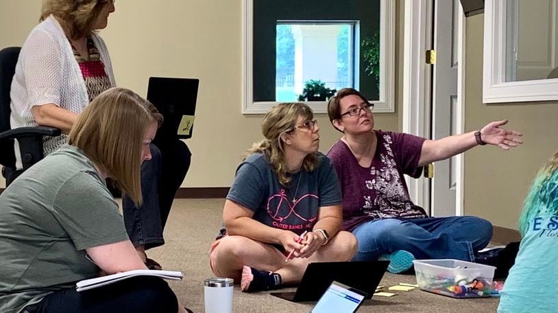 Teachers at the Community Steam School- Xenia brainstorm lesson plans for the year ahead of the school’s inaugural class. LONDON BISHOP/STAFF