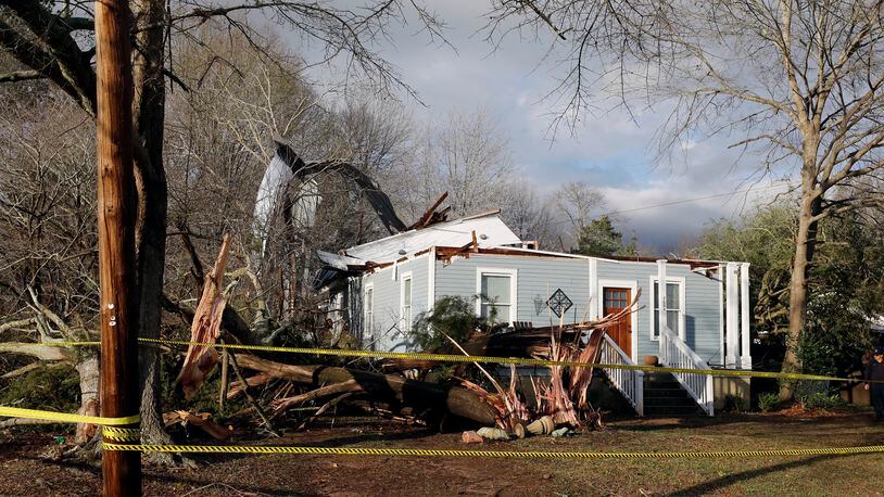 Debris lies on the ground at the home of Ellen Green and Johnny Green on Sunday, Jan. 22, 2017 in Opelika, Ala. The National Weather Service said Sunday that southern Georgia, northern Florida and the corner of southeastern Alabama could face "intense and long track" tornadoes, scattered damaging winds and large hail. (Todd J. Van Emst/Opelika-Auburn News via AP)