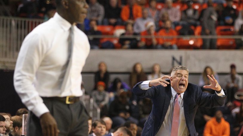 Auburn’s Bruce Pearl, right, yells to his team during a game against Dayton on Saturday, Dec. 8, 2018, at Auburn Arena in Auburn, Ala.