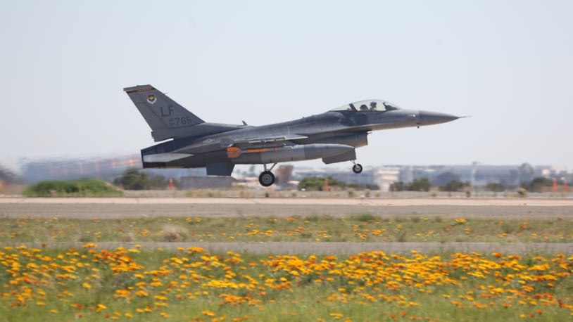 An F-16 Falcon with the Air Forces 310th Fighter Squadron takes off en route to a simulated dog fight against F/A-18 Hornets with Marine Fighter Attack Squadron (VMFA) 314 at Marine Corps Air Station Miramar, California.