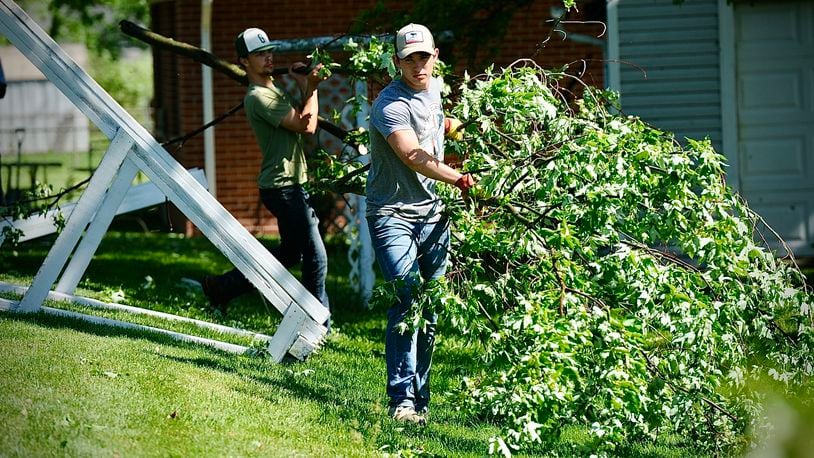 Students from Greenville High School came out to help neighbors around the area clean up their yards after strong storms hit the area Tuesday night, May 7, 2024. MARSHALL GORBY/STAFF