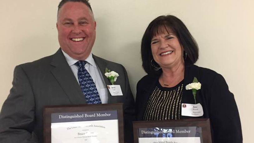 Bruce Clapp (left) and Jane Woodie (right) were recognized for their 20 years of service with the Northmont Board of Education