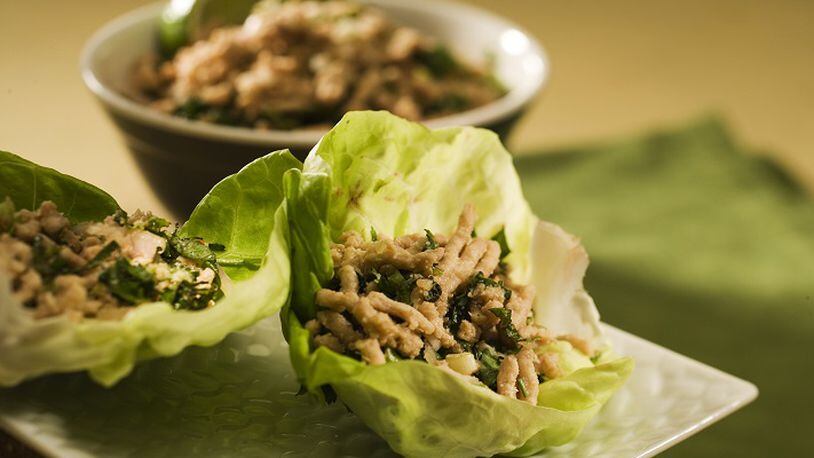 Tuck Thai-spiced ground chicken into lettuce wraps, and pop open a bottle of wine. (Bob Fila/Chicago Tribune/TNS)