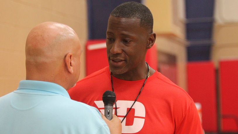 Dayton coach Anthony Grant talks to WHIO’s Larry Hansgen before an individual skill instruction workout on Thursday, Sept. 21, 2017, at the Cronin Center. David Jablonski/Staff