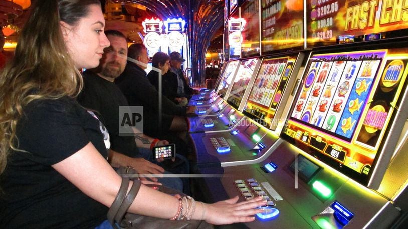 Gamblers play slot machines inside the Ocean Resort Casino on Monday, June 25, 2018, the first day of so-called "soft play" in advance of the casino's formal opening on June 28. The property is the former Revel casino. (AP Photo/Wayne Parry)