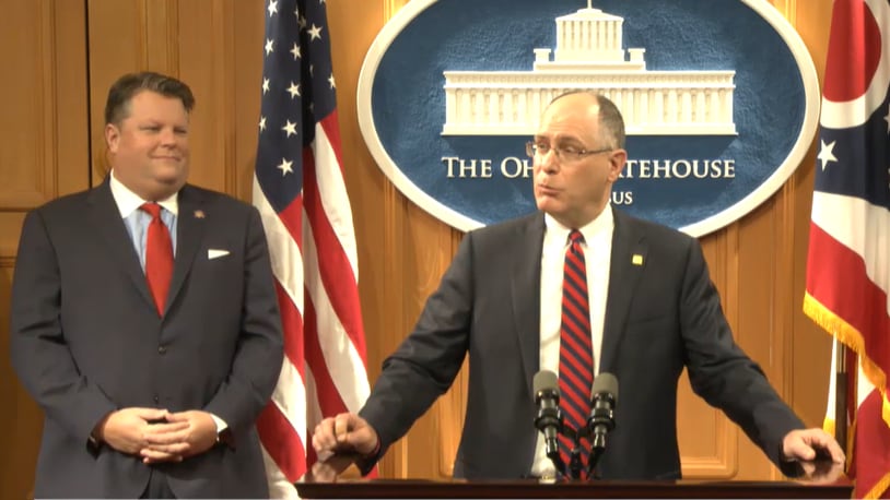 University of Dayton president Eric Spina, center, speaks at a press conference on Monday regarding the state's "brain drain" of college students leaving to take jobs elsewhere. Ohio State Rep. Jon Cross (R-Kenton) looks on. Contributed by Ohio Channel.