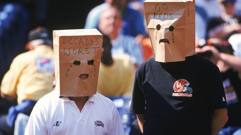 3 Oct 1999: Fans of the Cincinnati Bengals wear unhappy paper bag faces crying about the Cincinnati Reds worst season during a game against the St. Louis Rams at the Riverfront Stadium in Cincinnati, Ohio. The Rams defeated the Bengals 38-10. Mandatory Credit: Andy Lyons /Allsport