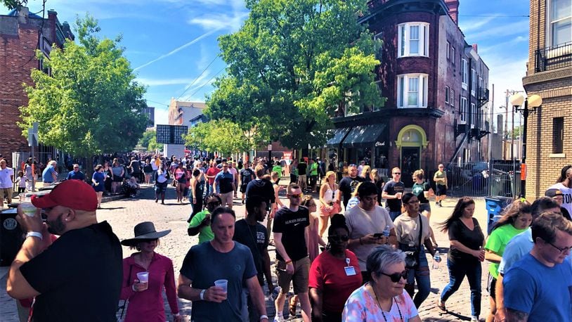 The Oregon District could become an outdoor entertainment district by 2020. Many people had beers on the street during the Gem City Shine concert, hosted by Dave Chappelle. CORNELIUS FROLIK / STAFF