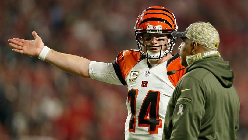 GLENDALE, AZ - NOVEMBER 22: Quarterback Andy Dalton #14 of the Cincinnati Bengals (left) talks with head coach Marvin Lewis (right) during the first half of the NFL game against the Arizona Cardinals at the University of Phoenix Stadium on November 22, 2015 in Glendale, Arizona.  (Photo by Christian Petersen/Getty Images)