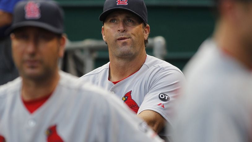 Cardinals manager Mike Matheny looks up at the scoreboard before a game against the Reds on Tuesday, Aug. 4, 2015, at Great American Ball Park in Cincinnati. David Jablonski/Staff
