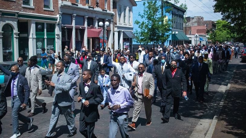 More than 300 black men marched through the streets of downtown and the Oregon District Sunday, June 14 as part of the Suits in Solidarity, an event organized by Brandon White, the owner of White House Event Center, 101 E. 2nd St, Dayton. He said he hopes it becomes an annual tradition.
