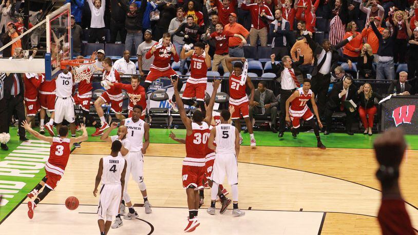 The Wisconsin bench reacts after Bronson Koenig's last second 3-point shot against Xavier to give Wisconsin a 66-63 victory in a second-round men's college basketball game in the NCAA Tournament, Sunday, March 20, 2016, in St. Louis. (Chris Lee/St. Louis Post-Dispatch via AP) EDWARDSVILLE INTELLIGENCER OUT; THE ALTON TELEGRAPH OUT; MANDATORY CREDIT