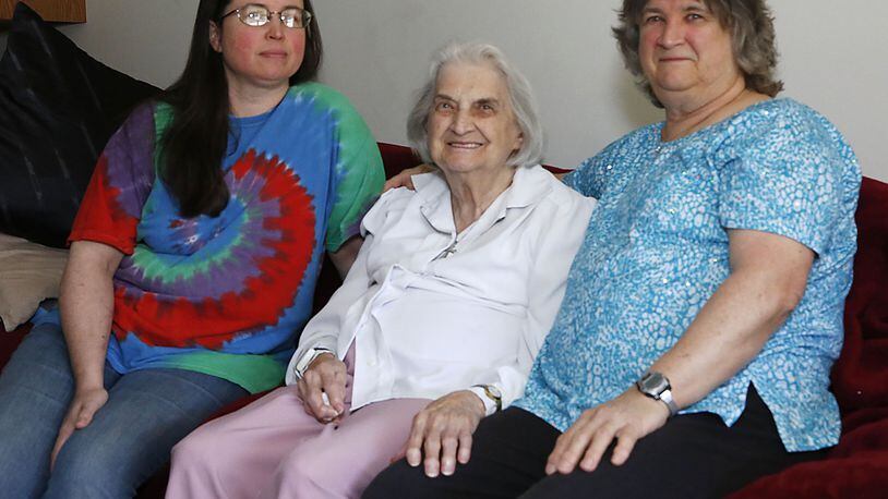 Jeanette Acker, center, with her granddaughter Jennifer Martin, left, and daughter Pat Acker, right, pictured in a family photo from 2019, before the pandemic.