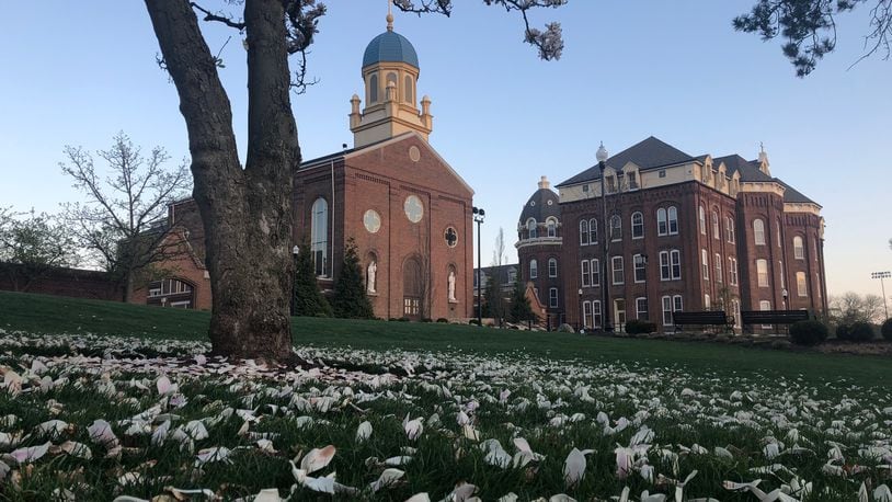 The University of Dayton’s campus — from library lawn, to Chapel of the Immaculate Conception and St. Joseph Hall — sits nearly empty on a recent April day. JEREMY P. KELLEY / STAFF