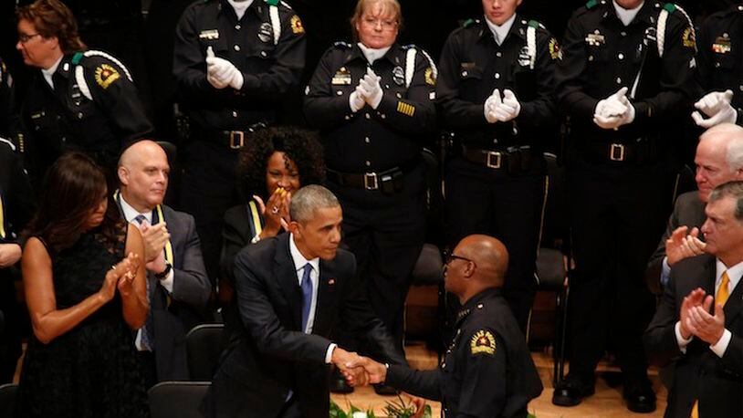President Barack Obama shakes hands with Dallas Police Chief David Brown, who attended a memorial service on July 12, 2016 at the Morton H. Meyerson Symphony Center in Dallas, Texas, where police officers gunned down by an angry sniper were honored. (Barbara Davidson/Los Angeles Times/TNS)