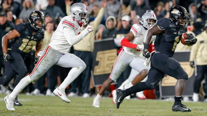 D.J. Knox of the Purdue Boilermakers runs for a touchdown as Jordan Fuller of the Ohio State Buckeyes pursues at Ross-Ade Stadium last season in West Lafayette, Indiana. (Photo by Michael Hickey/Getty Images)