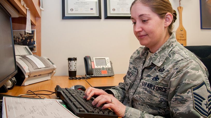 Master Sgt. Misti Rodriguez, Academic Coding Branch superintendent, inputs a transcript into the Air Force Military Personnel Data System to update an officer’s record. Two Airmen at the Coding Branch, including Rodriguez, update more than 1,000 transcripts a month in support of some 130,000 total force Air Force officers. (U.S. Air Force photo/John Harrington)