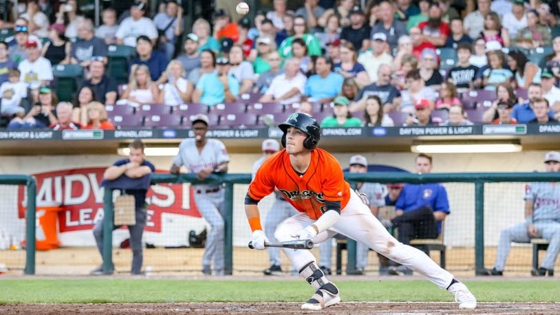 Dayton Dragons center fielder Michael Siani watches his bunt attempt fly into the air during a game against the Wisconsin Timber Rattlers in 2019. CONTRIBUTED PHOTO BY MICHAEL COOPER