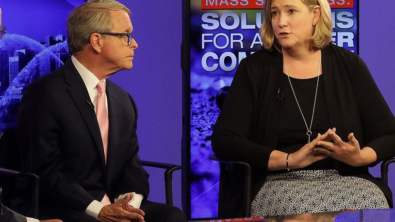 Ohio Gov. Mike DeWine and Dayton Mayor Nan Whaley received the most campaign contributions in the race for Ohio governor during the first half of 2021. In this 2019 file photo DeWine and Whaley participate in a forum about gun violence in the wake of the Aug. 4 mass shooting in Dayton's Oregon District.. BILL LACKEY/STAFF