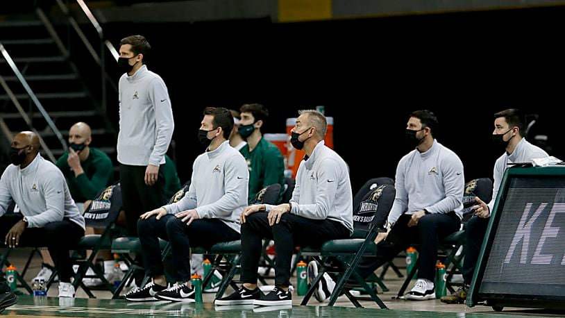 Wright State head coach Scott Nagy, center, and the coaching staff watch their team play Green Bay during a men's basketball game at the Nutter Center in Fairborn Saturday, Dec. 26, 2020. E.L. Hubbard/CONTRIBUTED