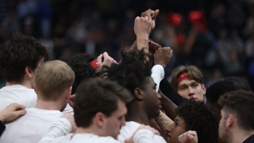 Dayton huddles during a game against Arizona in the second round of the NCAA tournament on Saturday, March 23, 2024, at the Delta Center in Salt Lake City, Utah. David Jablonski/Staff