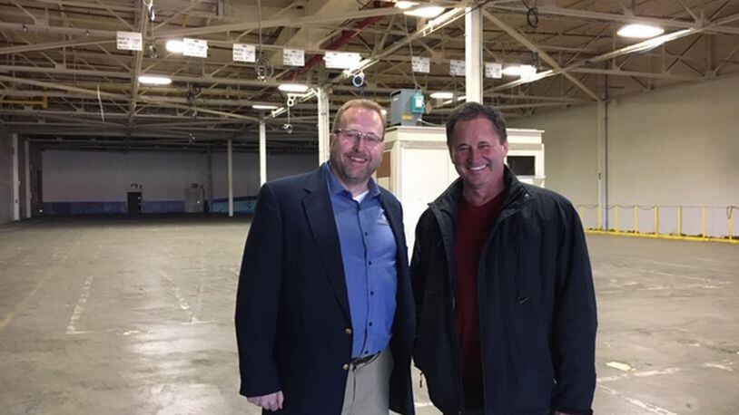 From left, John Busbee, chief executive of Xerion Advanced Battery Corp., and Martin Rucidlo, Xerion director of operations, inside a large bay in the former Delphi Northwoods Boulevard plant, a plant now owned by Xerion. Busbee envisions having perhaps 1,200 employees in the plant in five years. THOMAS GNAU/STAFF