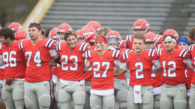 Dayton players celebrate a victory against Butler on Saturday, Oct. 30, 2021, at Welcome Stadium. At left is A.J. Watson. David Jablonski/Staff