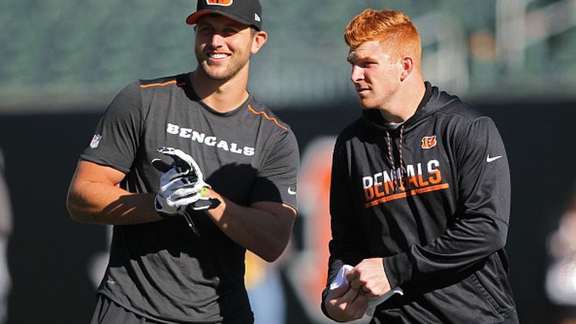 CINCINNATI, OH - OCTOBER 23: Tyler Eifert #85 and Andy Dalton #14 of the Cincinnati Bengals talk while warming up prior to the start of the game against the Cleveland Browns at Paul Brown Stadium on October 23, 2016 in Cincinnati, Ohio. (Photo by John Grieshop/Getty Images)