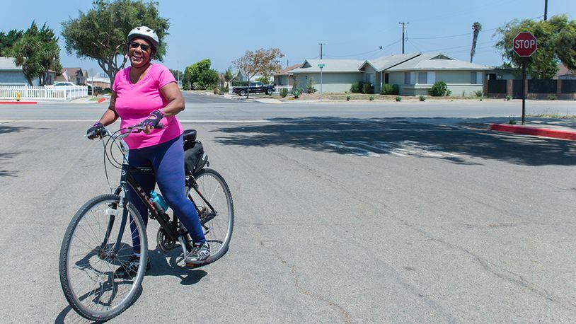 Leslie Robinson gets ready for a bike ride in Lompoc, Calif., on Friday, August 18, 2017. The 62-year-old said she had ongoing knee pain that kept her from biking, walking her dogs and tending to her fruit trees. (Heidi de Marco/KHN)
