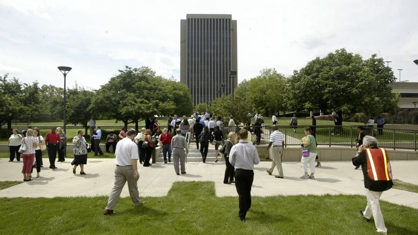 Workers are pictured outside the Montgomery County Administration Building in Dayton.