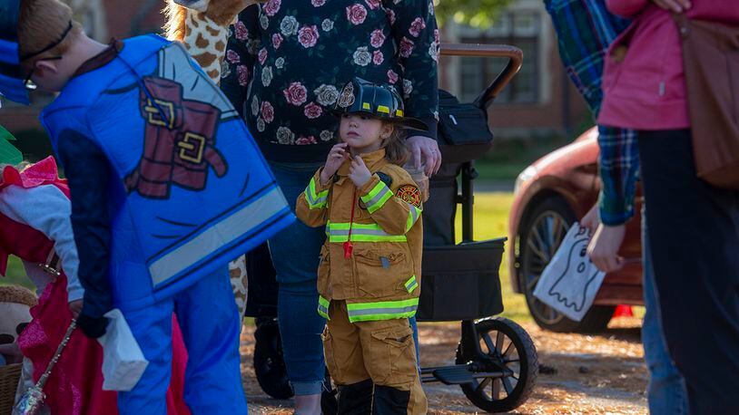 Lynnex Willis, dressed in a firefighter costume, participates in the Great Pumpkin Off and “Trunk or Treat” event Oct. 21 at Wright-Patterson Air Force Base. The gathering featured several base organizations passing out candy to children and activities for families to enjoy. U.S. AIR FORCE PHOTO/SENIOR AIRMAN JACK GARDNER