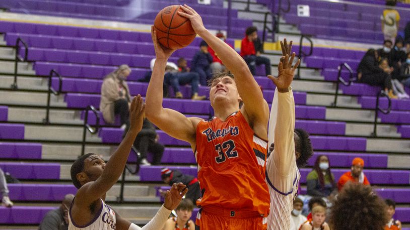 Beavercreek's Gabe Phillips scores against Thurgood Marshall in the second half Saturday night. Phillips scored 24 points in the Beavers' victory. Jeff Gilbert/CONTRIBUTED