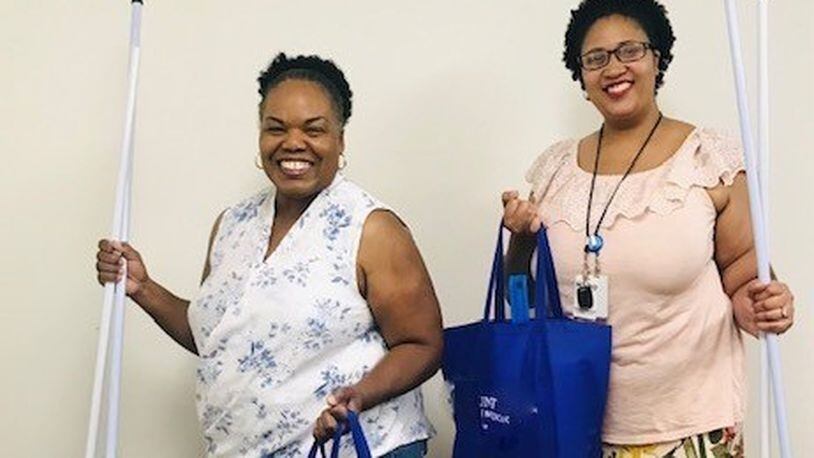 MVHO Staffers Daisy Nease (left) and Chrystal Steward show off the everyday essentials that are always needed. CONTRIBUTED