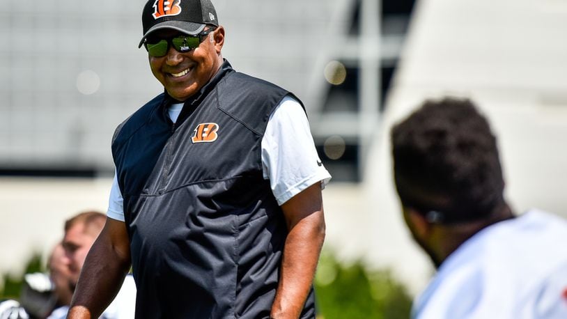 Head Coach Marvin Lewis smiles at a player during the first day of Cincinnati Bengals Training Camp Friday, July 28 at the practice fields beside Paul Brown Stadium in Cincinnati. NICK GRAHAM/STAFF