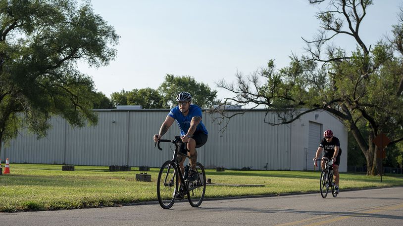 Two sprint triathlon competitors race in a 20K bike ride Sept. 11 at Wright-Patterson Air Force Base. Athletes completed a 750-yard swim, 20K bike ride and 5K run. U.S. AIR FORCE PHOTO/STAFF SGT. MIKALEY KLINE