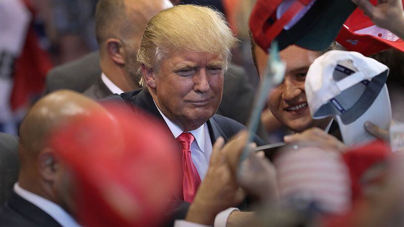 SCRANTON, PA - JULY 27: Republican Presidential candidate Donald Trump signs autographs and poses for photos after his speech on July 27, 2016 in Scranton, Pennsylvania. Trump spoke at the Lackawanna College Student Union Gymnasium. (Photo by John Moore/Getty Images)