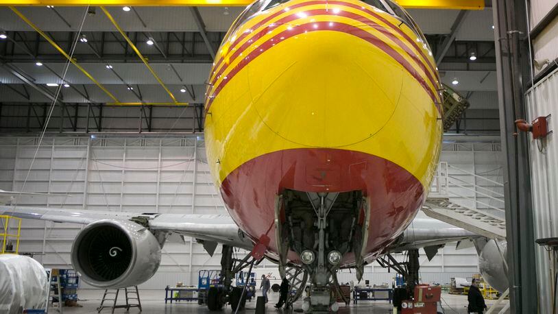 A Boeing 767 painted in DHL livery within a hangar at Airborne Maintenance and Engineering Services at the Wilmington Air Park. TY GREENLEES / STAFF