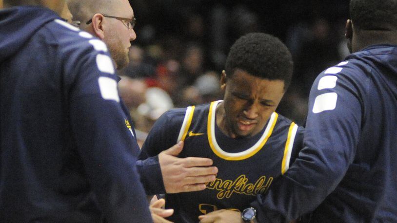 Springfield senior Michael Wallace takes a hard loss. Moeller defeated Springfield 65-44 in a boys high school basketball D-I regional semifinal at Xavier University’s Cintas Center in Cincinnati on Wednesday, March 14, 2018. MARC PENDLETON / STAFF