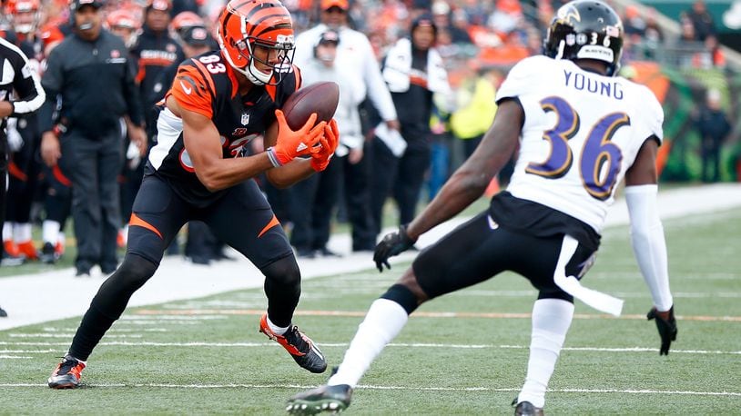 CINCINNATI, OH - JANUARY 1: Tyler Boyd #83 of the Cincinnati Bengals catches a pass while being defended by Tavon Young #36 of the Baltimore Ravens during the second quarter at Paul Brown Stadium on January 1, 2017 in Cincinnati, Ohio. (Photo by Michael Hickey/Getty Images)