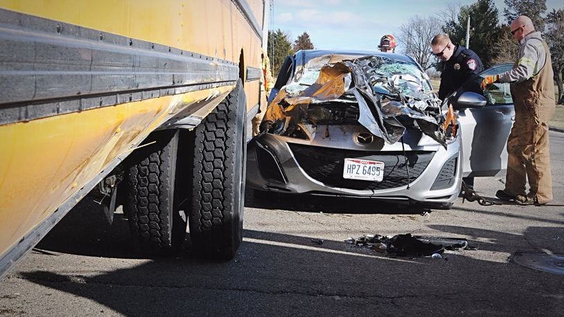 A car and a Miamisburg school bus were both damaged in a wreck at the intersection of South Heincke and Maue roads Thursday afternoon. MARSHALL GORBY.