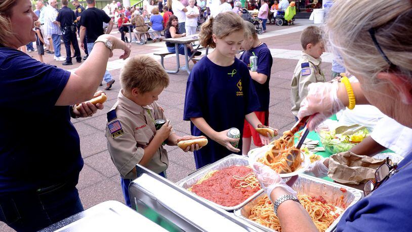 A free dinner is served at the National Night Out celebration on the City Hall Plaza during the 2015 event. It’s being moved to the playground area in Snyder Park this year. Bill Lackey/Staff