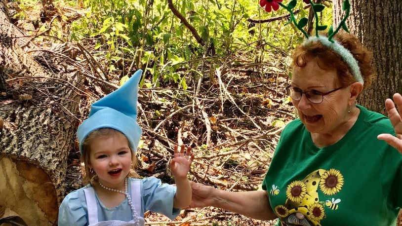 Judith Keegans is shown dancing with a Fairy and Gnome Home Festival visitor during a recent program at the Centerville-Washington Park District. /CONTRIBUTED