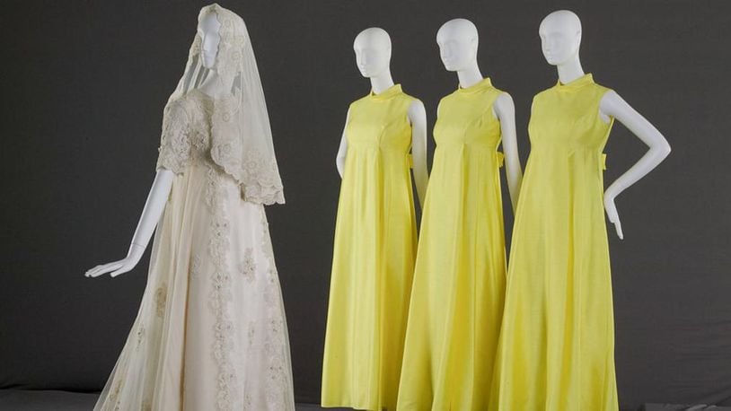Wedding dress and bridesmaid dresses, 1970. Synthetic satin, net, and lace by NA Hanna, Inc. (Photo by Chicago History Museum/Getty Images)