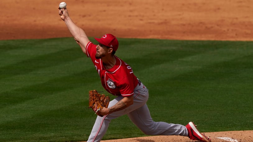 Cincinnati Reds' Michael Lorenzen throws against the Los Angeles Angels during the third inning of a spring training baseball game, Monday, March 15, 2021, in Tempe, Ariz. (AP Photo/Matt York)