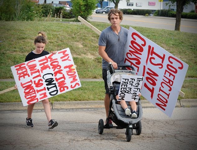 PHOTOS: Crowd gathers to protest COVID vaccine at Kettering Health