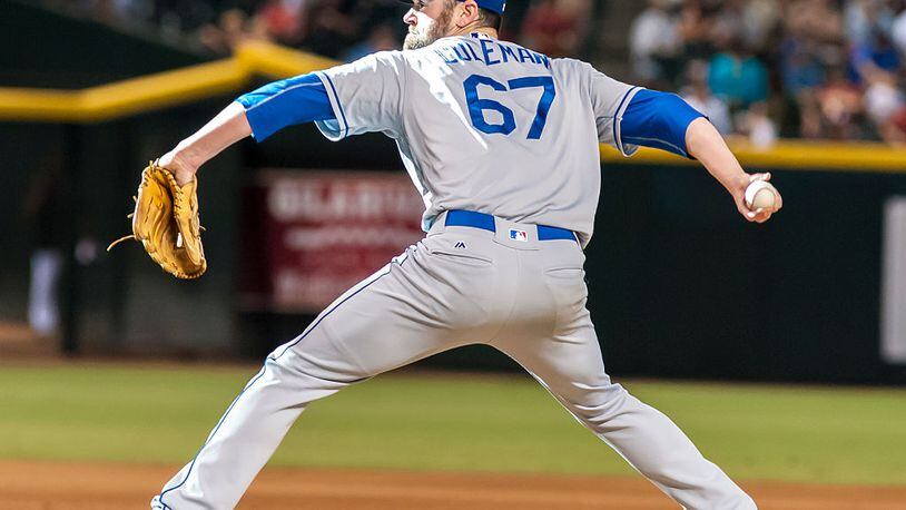 PHOENIX, AZ - SEPTEMBER 18: Relief pitcher Louis Coleman #67 of the Los Angeles Dodgers throws a pitch in the eighth inning of the MLB game against the Arizona Diamondbacks at Chase Field on September 18, 2016 in Phoenix, Arizona. The Arizona Diamondbacks defeated the Los Angeles Dodgers 10-9 in 12 innings. (Photo by Darin Wallentine/Getty Images)