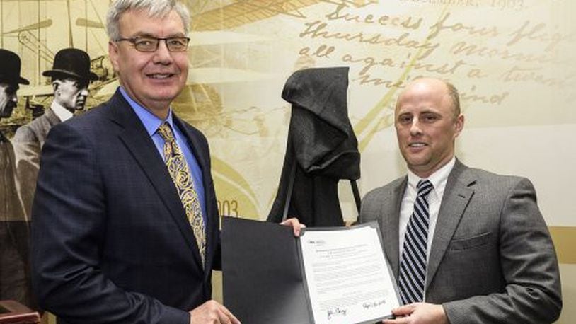 Ohio Higher Education chancellor John Carey awards Wright State’s Kevin Lorson the “Chancellor’s Award.”