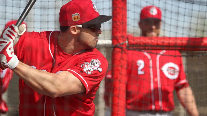 Reds left fielder Adam Duvall prepares to take a swing during batting practice last week in Goodyear, Ariz. MIKE HARTSOCK/STAFF