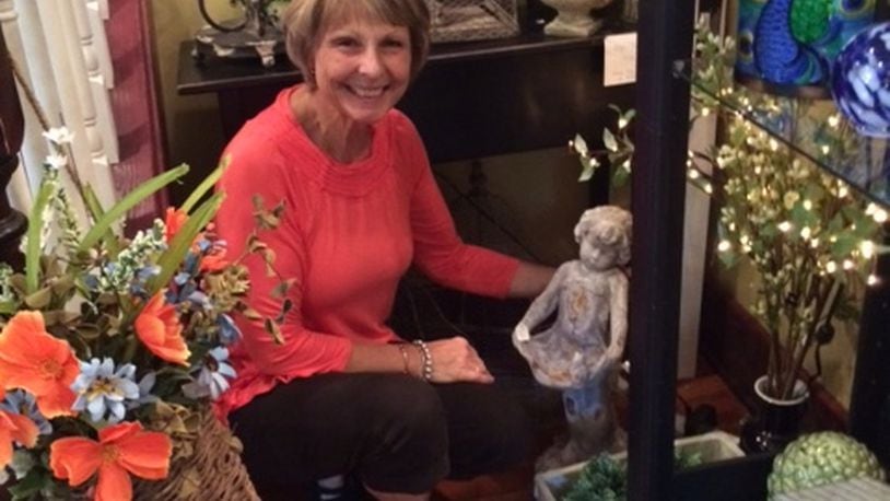 Deborah Tritschler in her Christmas Peddler House showing home decor and gifts. CONTRIBUTED