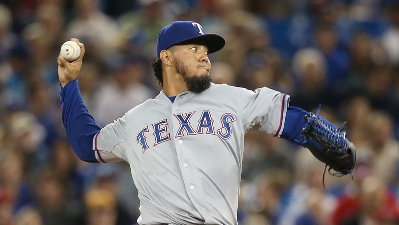 Yovani Gallardo pitches for the Rangers against the Blue Jays on June 27, 2015 at Rogers Centre in Toronto, Ontario, Canada. (Photo by Tom Szczerbowski/Getty Images)